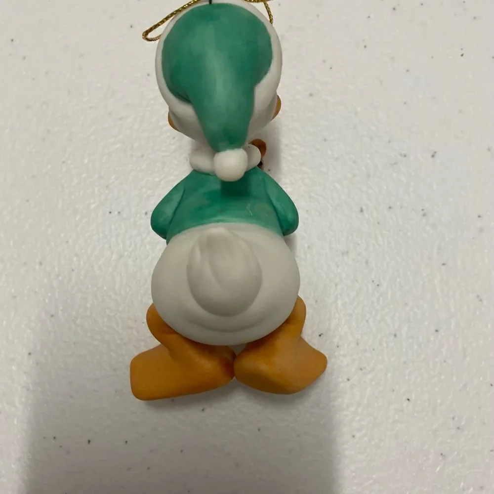 Disney Donal duck Santa holding teddy bear porcelain ornament